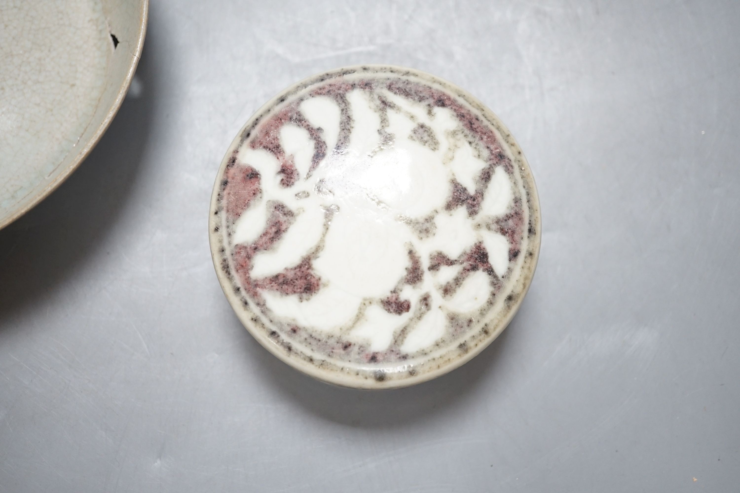 A Chinese porcelain paperweight and a saucer dish, 14 cm diameter
